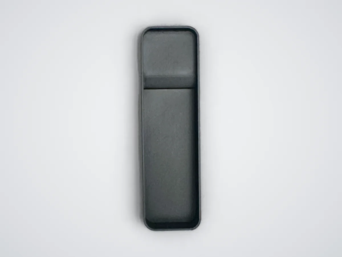 The thin ShadowFit test piece printed for a light remote, empty