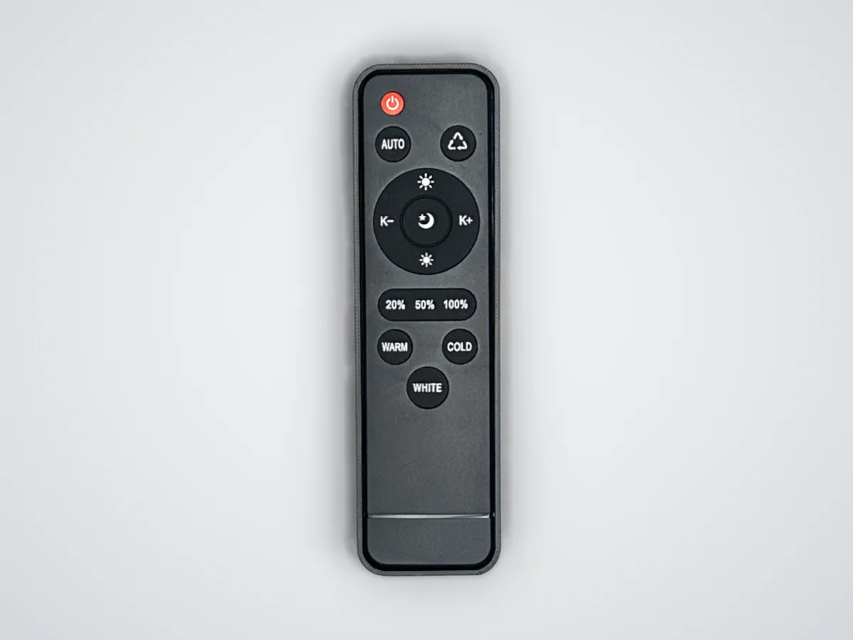 The light remote sitting in its ShadowFit test piece